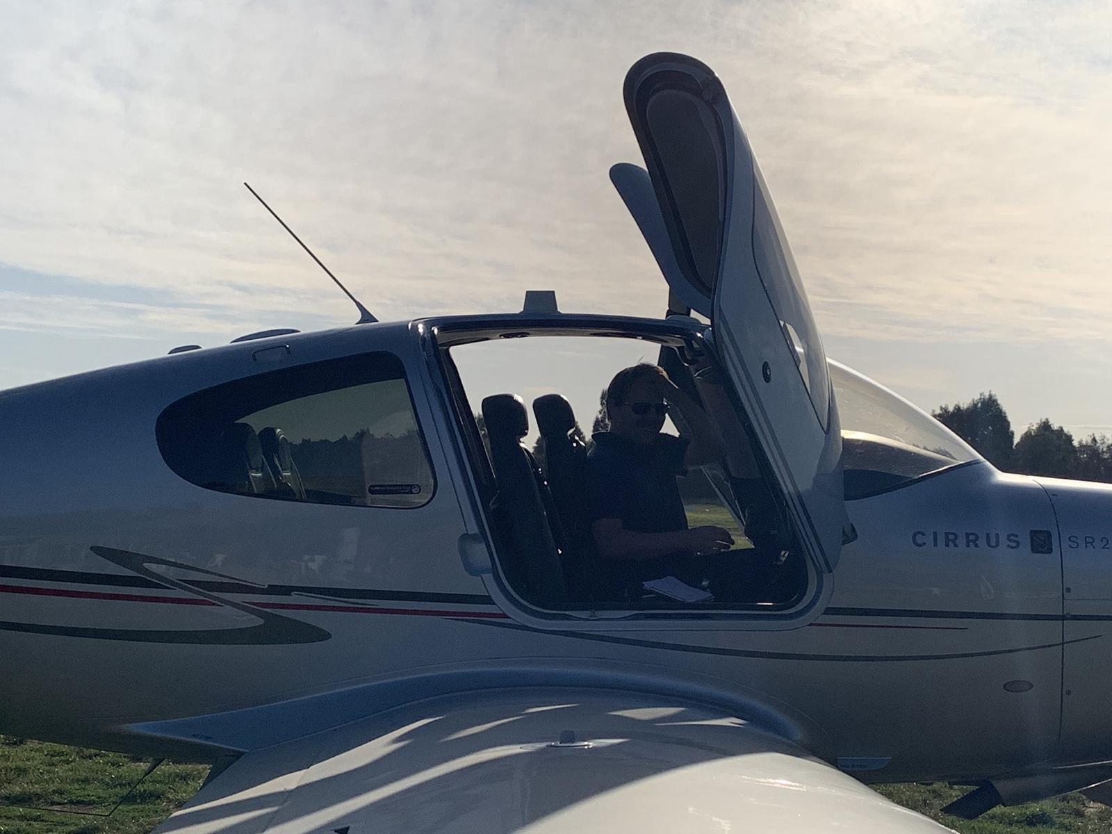 Dr Adam Hill in the cockpit of his Cirrus SR22