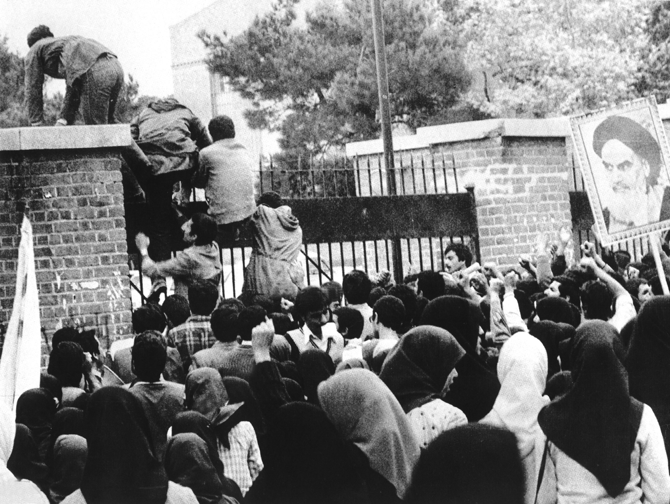 Iranian students climb the walls of the US Embassy in Tehran, November 1979. The 444-day hostage crisis is seared into American memory. The 26 years of dictatorship that preceded it are largely forgotten.